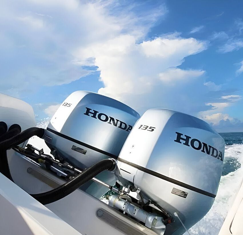 Two Honda Outboard Motors on a Boat in the Ocean — Mackay Marine Services in Mackay, QLD