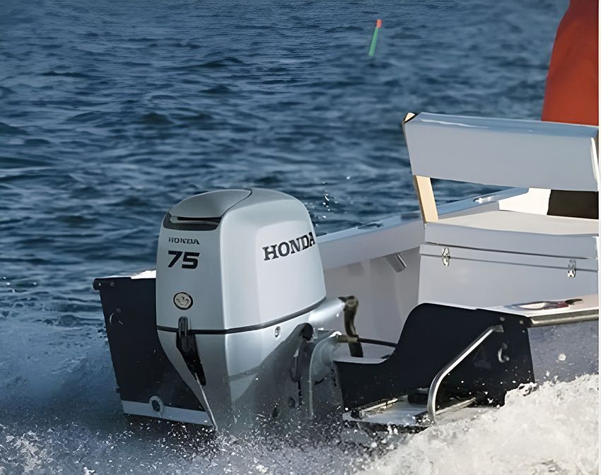 A Honda 75 Outboard Motor is Driving a Boat — Mackay Marine Services in Mackay, QLD