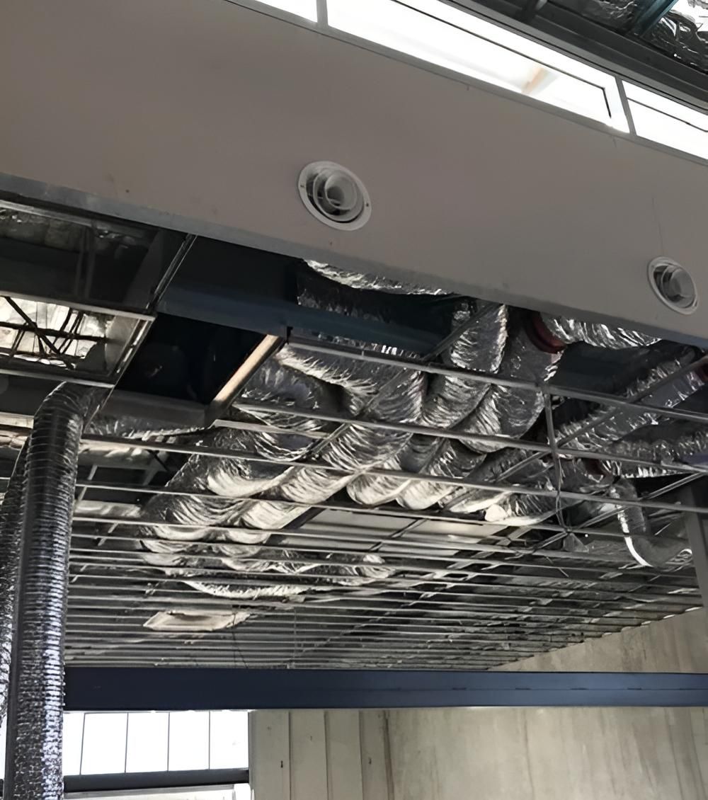 A Ceiling With a Lot of Pipes Coming Out of It — Sparky Mid North Coast In Forster, NSW