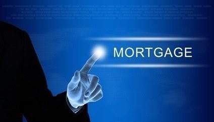 A person is pointing at the word mortgage on a screen.