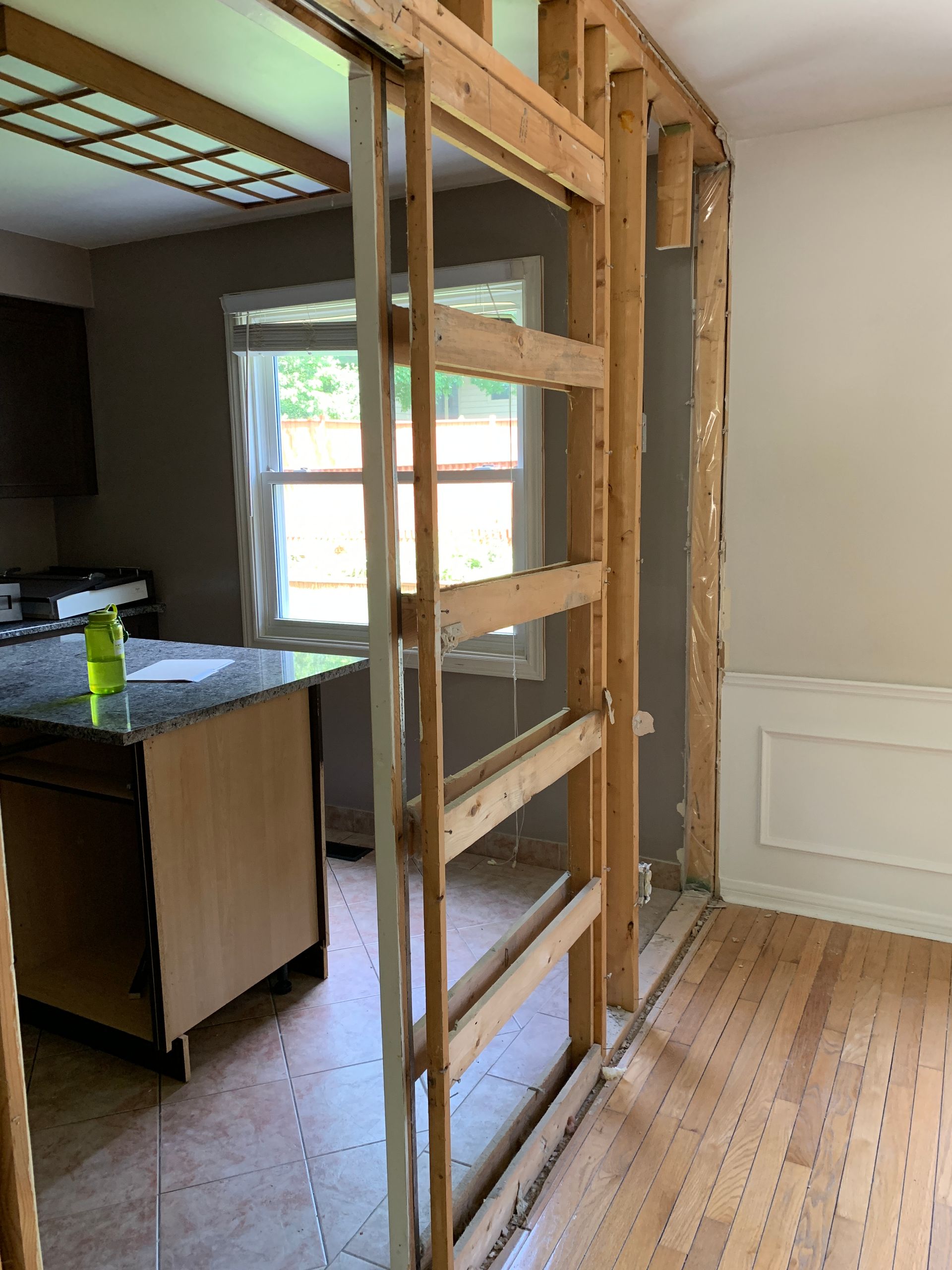 A room with a sliding glass door between two rooms.