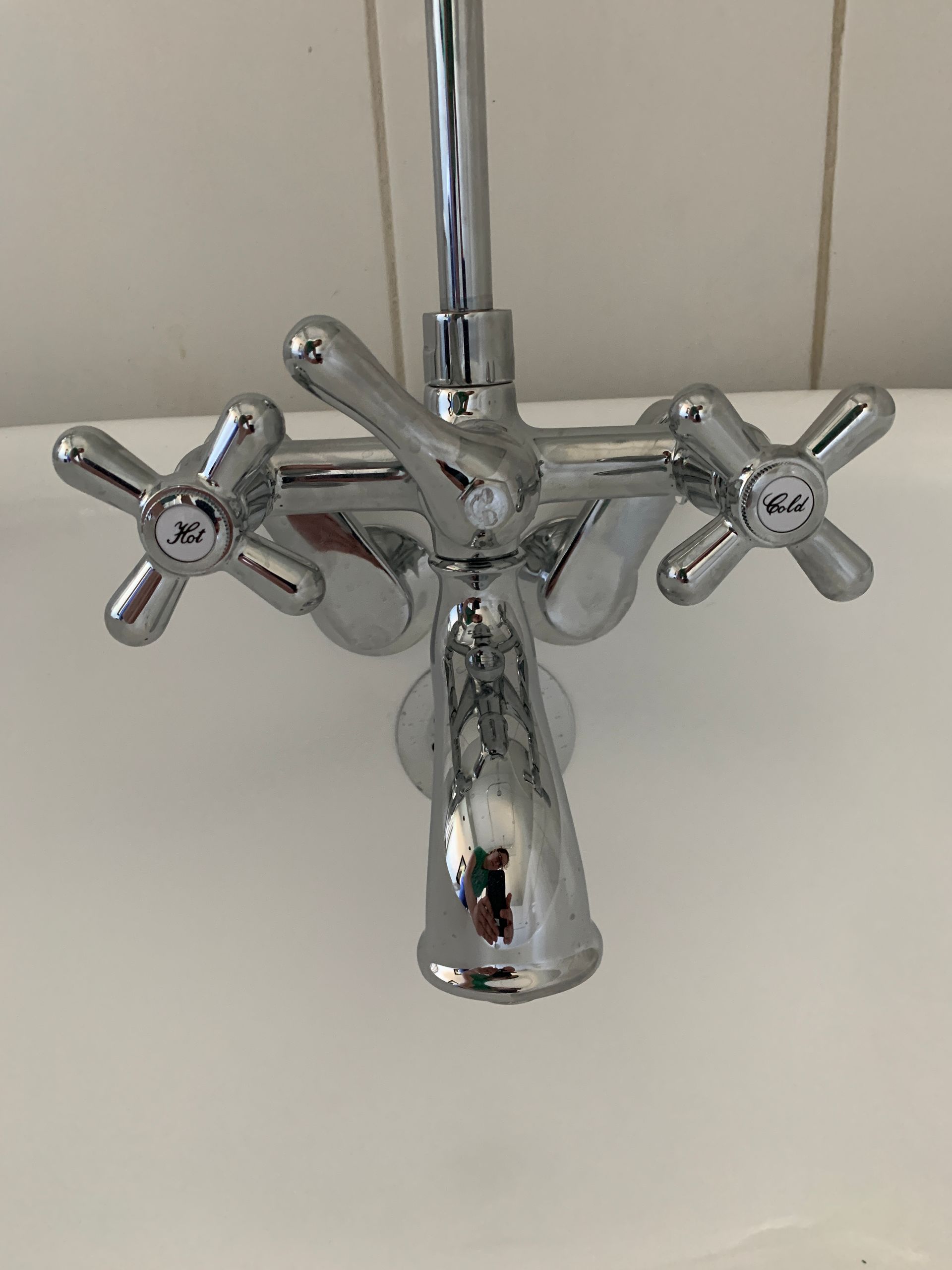 A close up of a chrome faucet on a sink