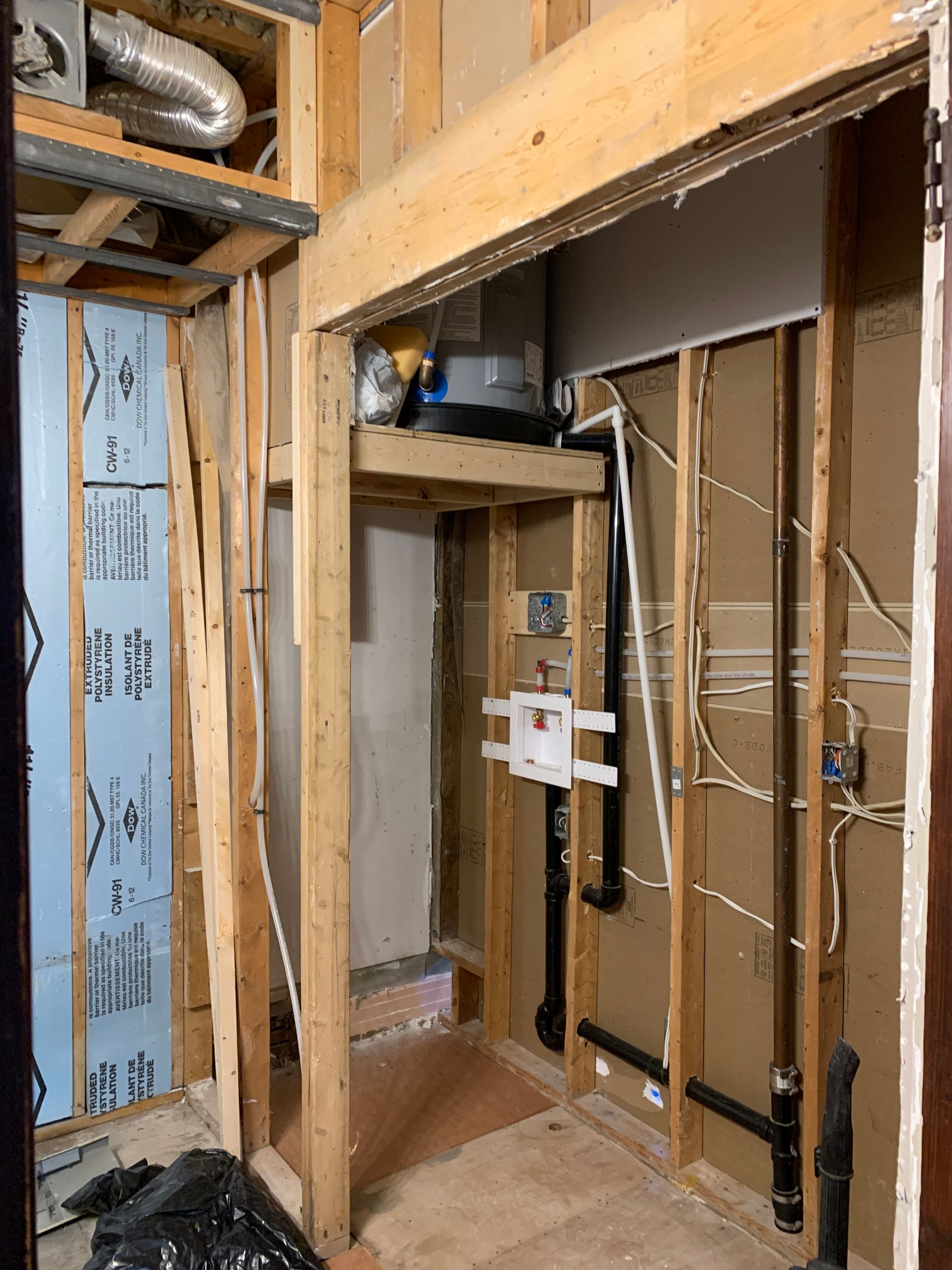 A room with a lot of wood and pipes in it