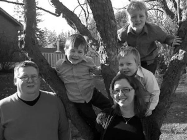 A bathroom with two sinks , two toilets , and a large mirror.