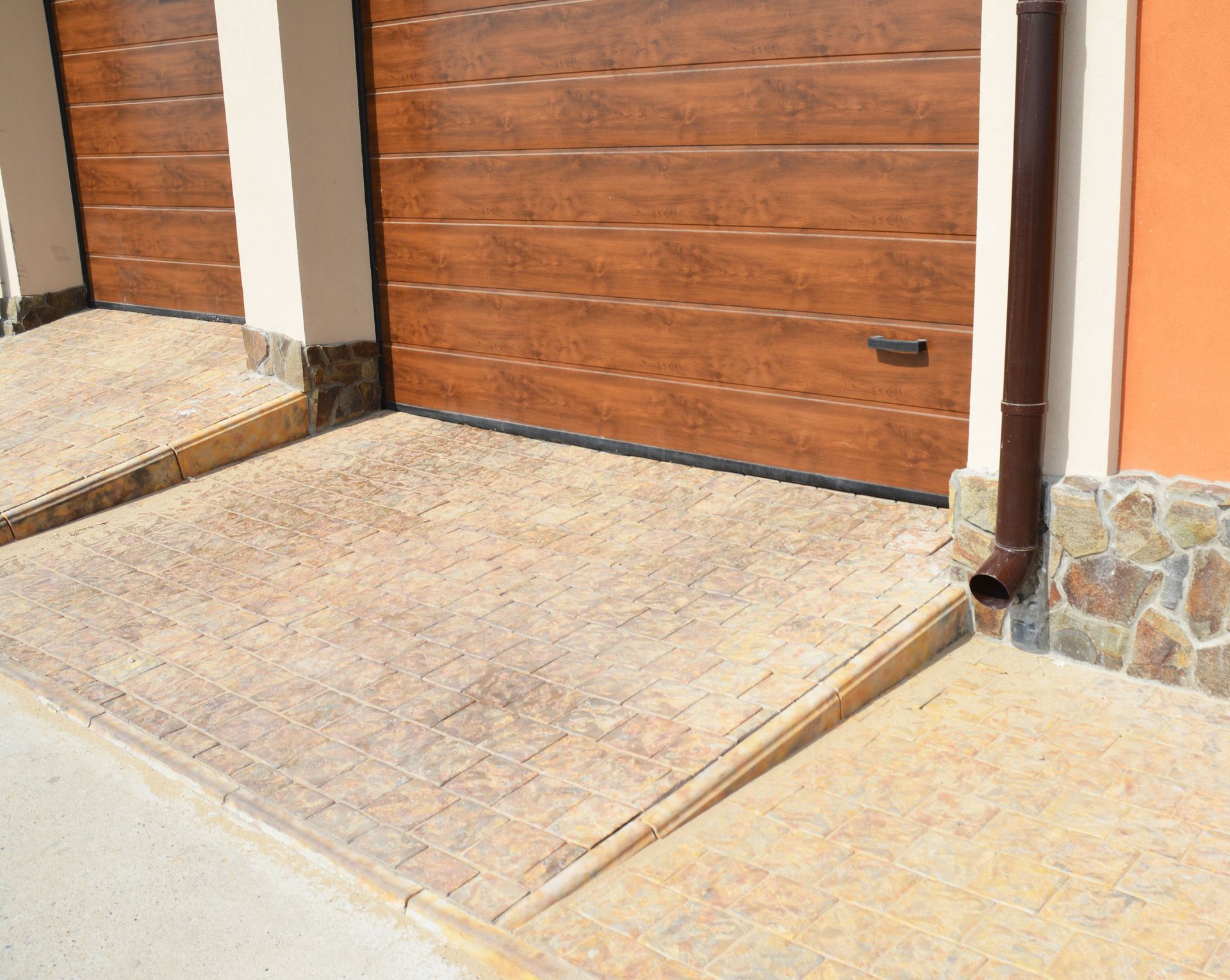 A group of people are standing in a room with a model of a house.