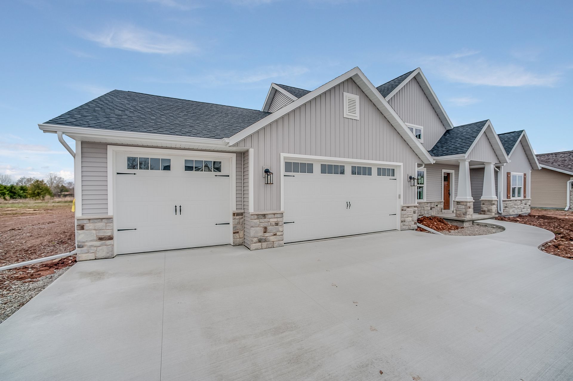 A building with a driveway in front of it