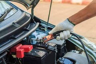 Mechanic Repairing Car Battery — Auto Repair in Ocean City, NJ