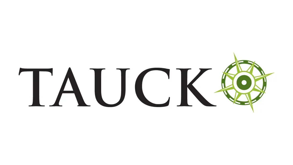 A logo for tauck with a green compass on a white background.