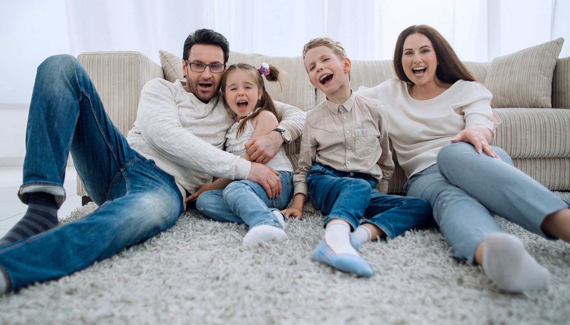 Simple Clean — Happy Family Sitting On Carpet in Richmond, VA Simple Clean — Happy Family Sitting On Carpet in Richmond, VA