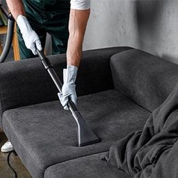 Upholstery Cleaning — Worker Cleaning The Sofa in Richmond, VA