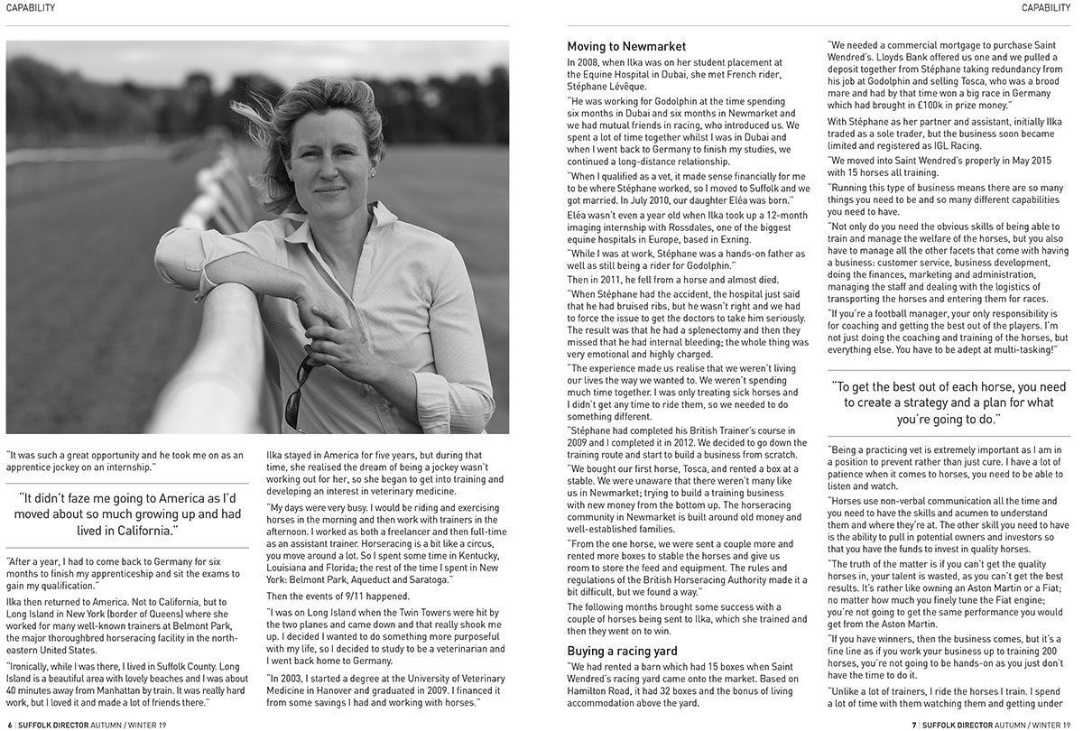 A woman is leaning on a railing in a black and white photo.