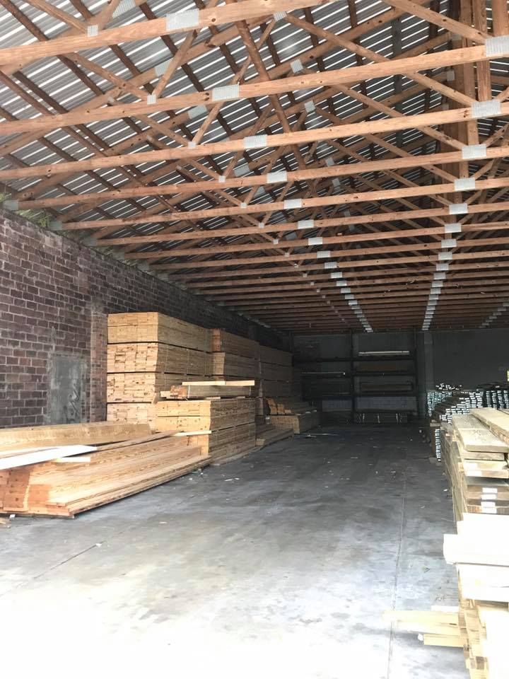 A large warehouse filled with lots of wooden boxes.