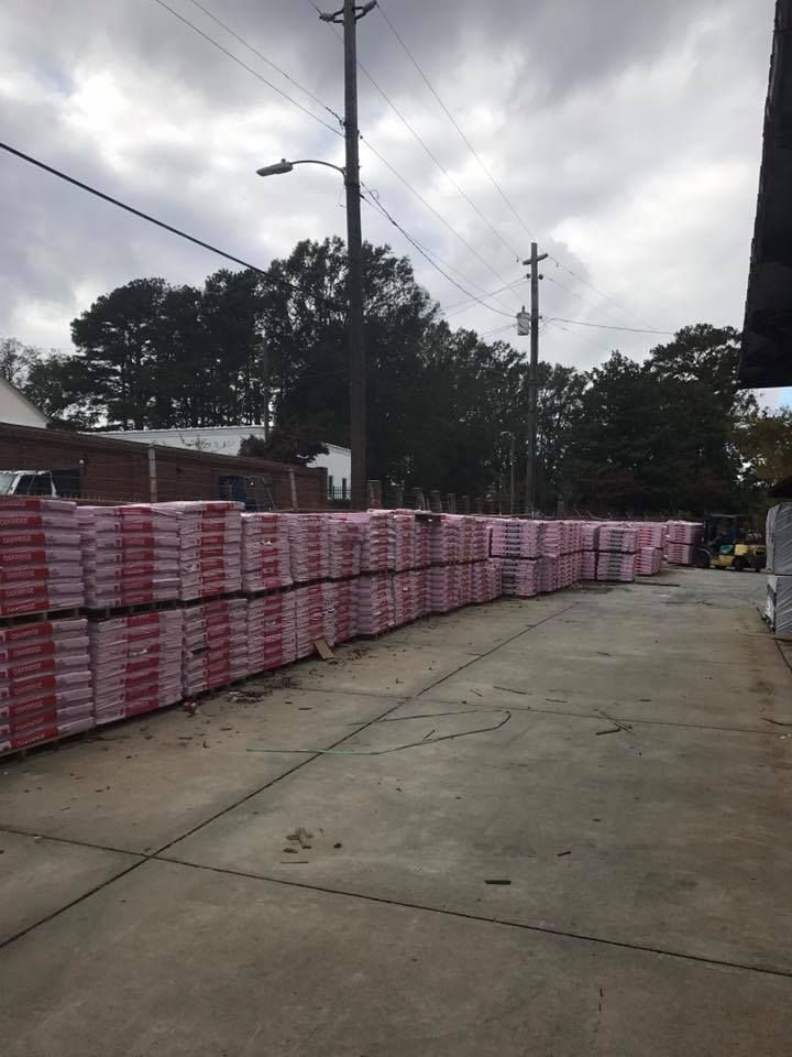 A row of bricks stacked on top of each other on a sidewalk