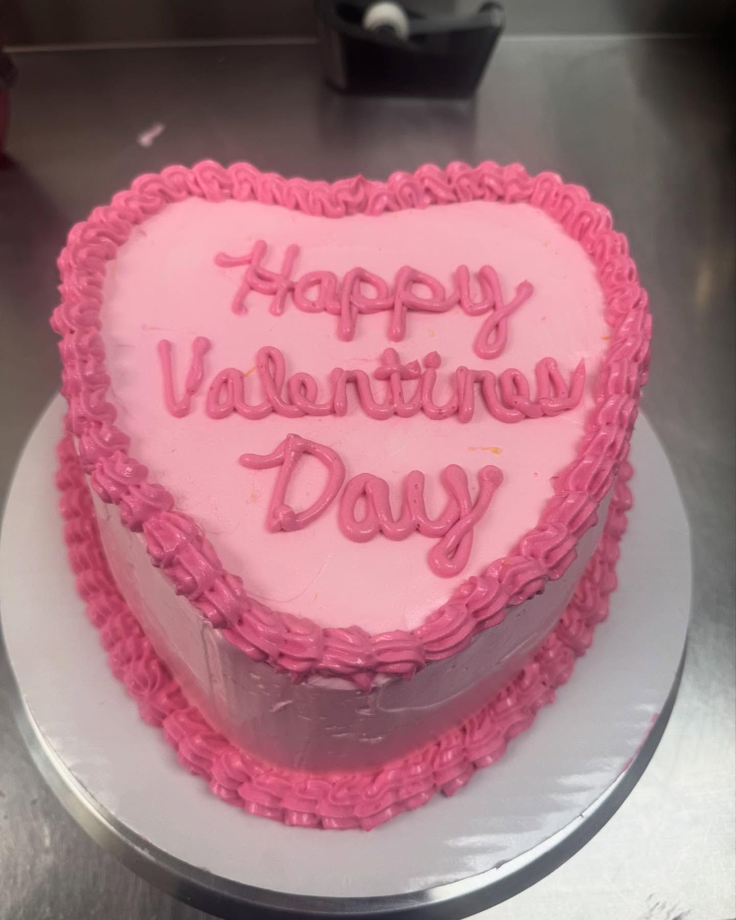 Pink heart-shaped cake with 