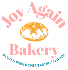 Logo for Joy Again Bakery, pink text, illustration of bread, tagline "gluten free never tasted so good."