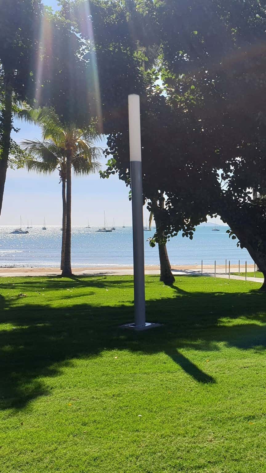 A Park With Trees And A Beach In The Background  — Marian Lawns In Moranbah, QLD