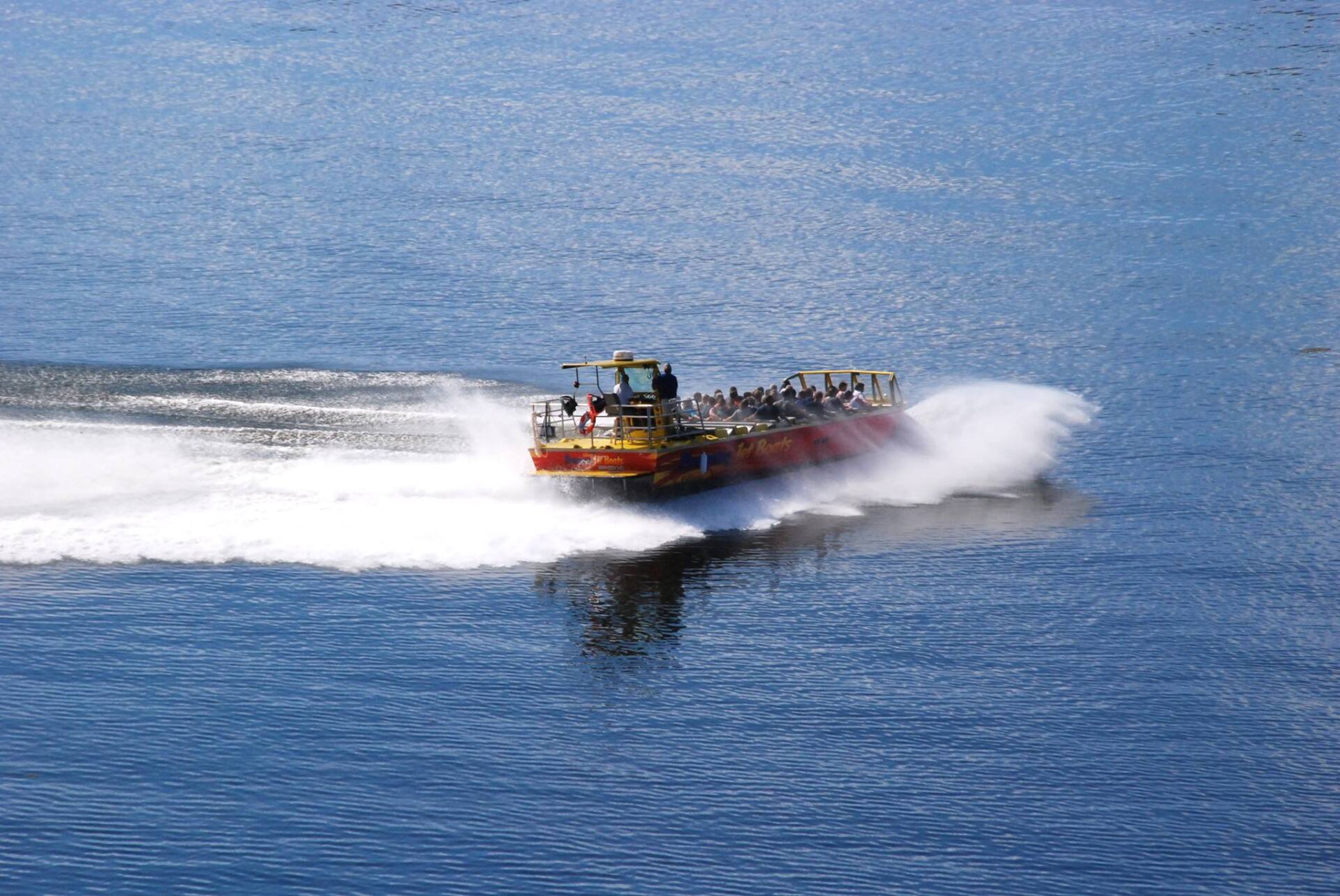 Branson Jet Boat in the water with people in it