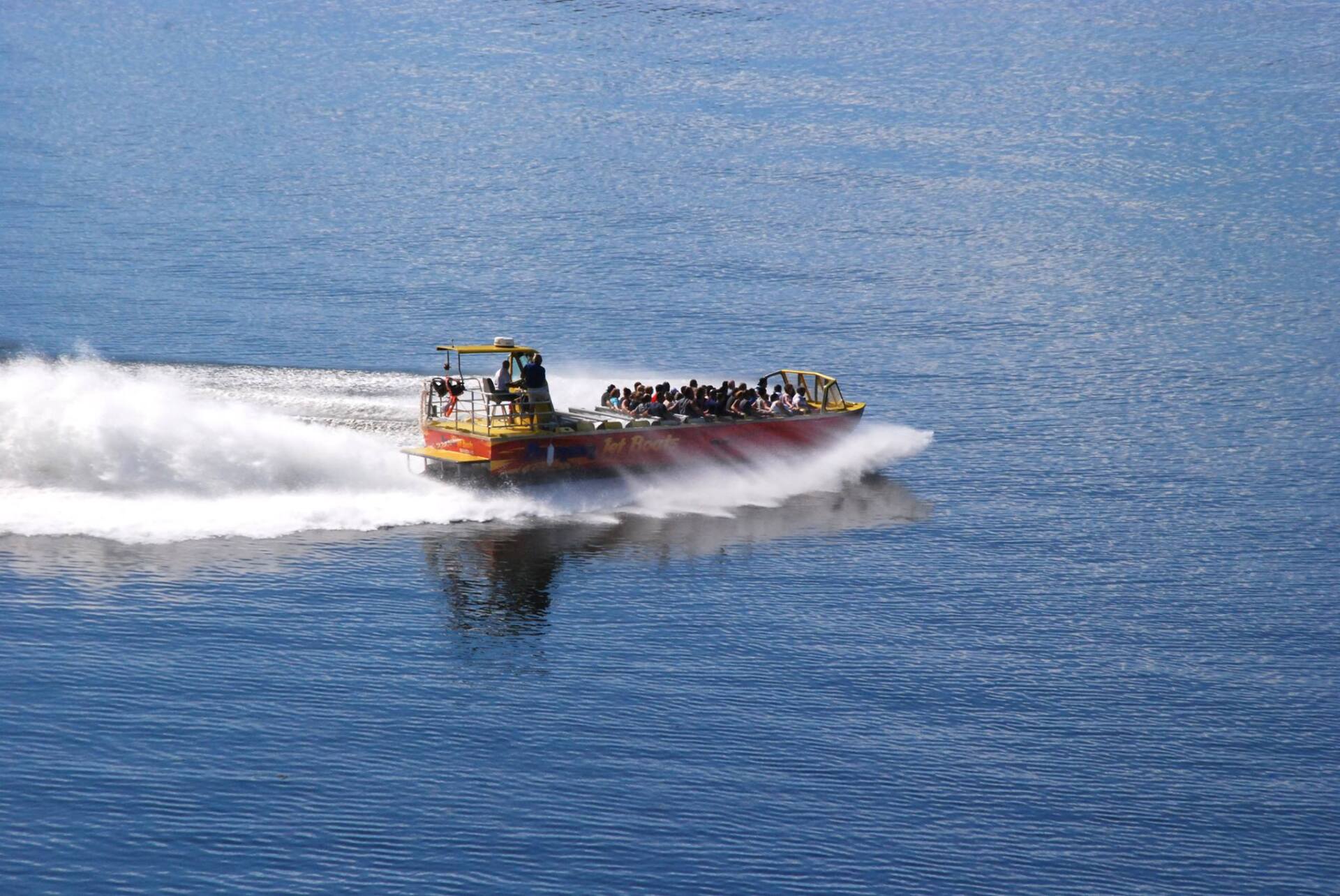 Branson Jet Boat on the water with people in it