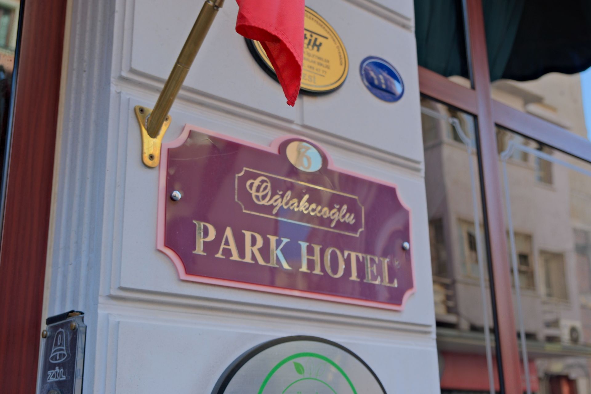 A maroon sign reading 