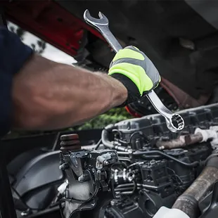 The engine of a truck is shown with the hood open.