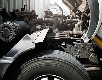 The engine of a truck is shown with the hood open.