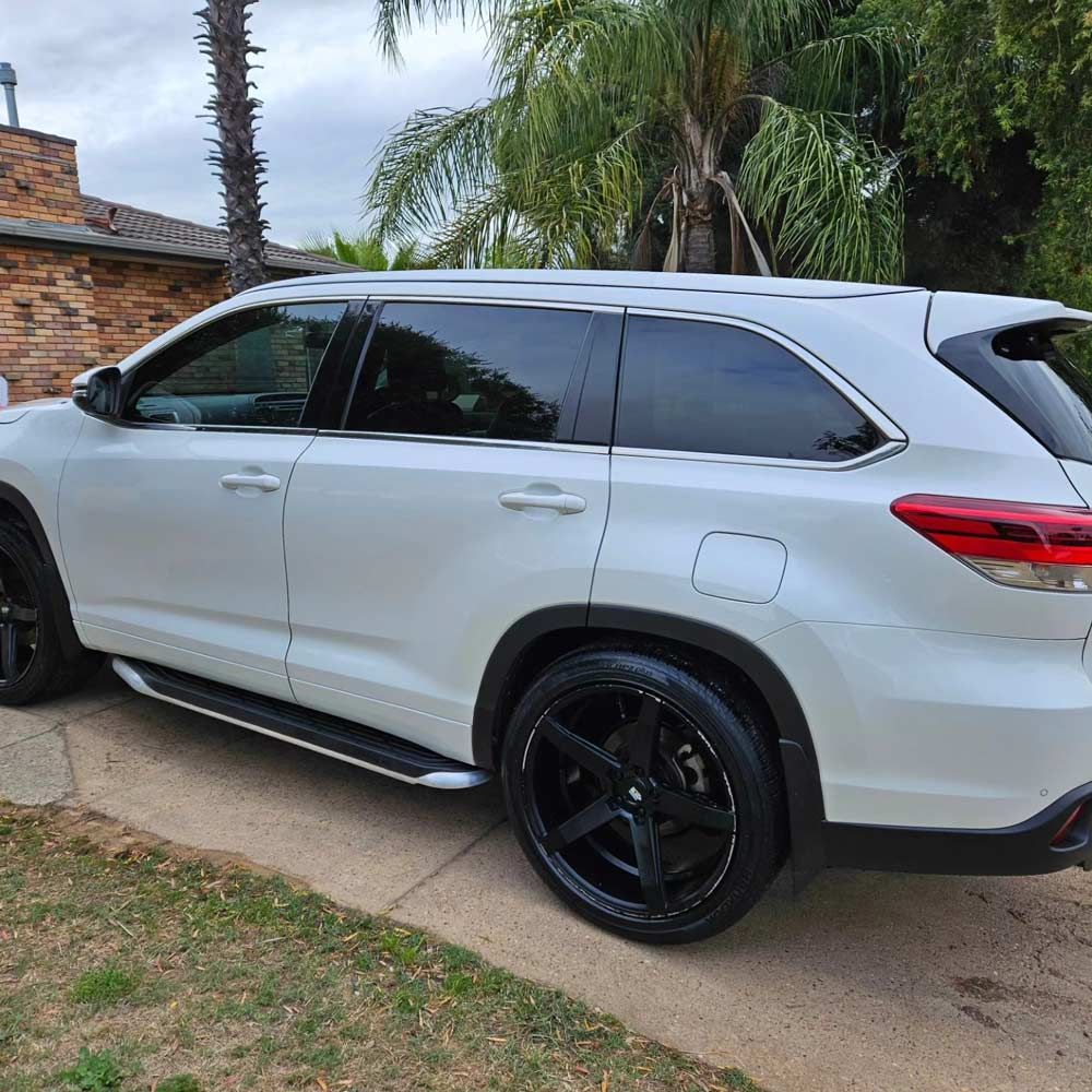 A White SUV is Parked On The Side Of The Road In Front Of A House — On Point Detailing Wagga in East Wagga Wagga, NSW