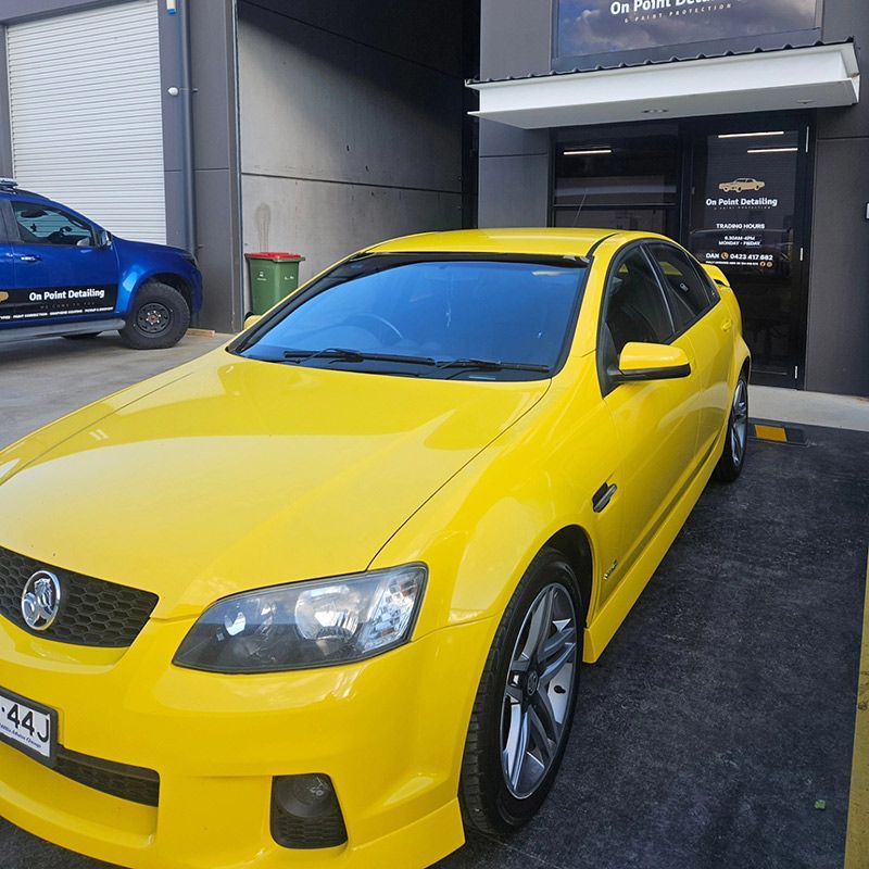 Yellow Car Parked In Front Of The On Point Detailing Shop — On Point Detailing Wagga in East Wagga Wagga, NSW