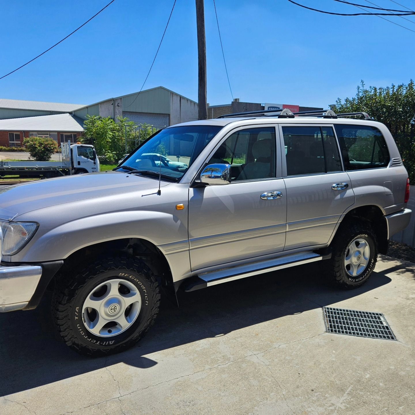 Silver SUV parked on a sunny residential street with houses and utility poles in the background — On Point Detailing Wagga in East Wagga Wagga, NSW
