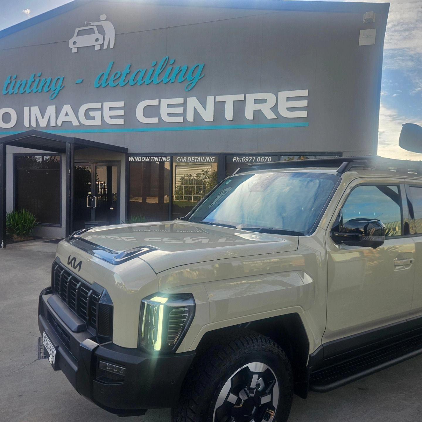 Beige SUV parked outside a car detailing shop with a dark storefront sign. — On Point Detailing Wagga in East Wagga Wagga, NSW