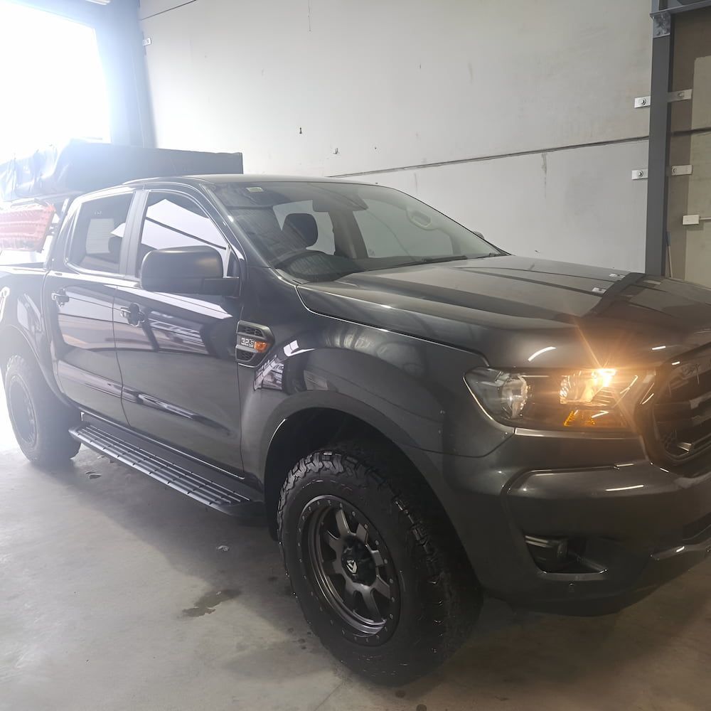 A Black Pickup Truck is Parked in a Garage — On Point Detailing Wagga in East Wagga Wagga, NSW