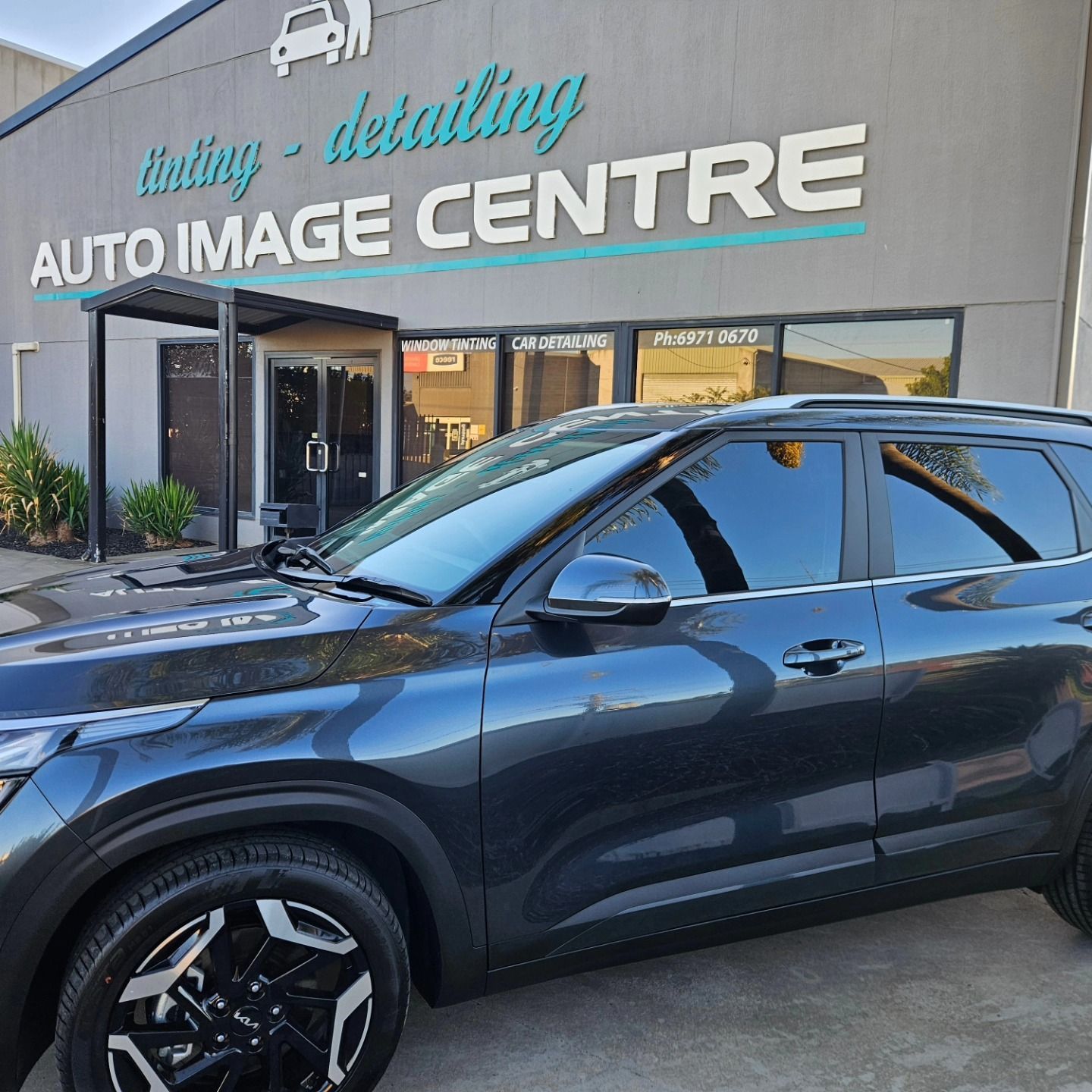 Dark gray SUV parked outside Auto Image Centre detailing shop — On Point Detailing Wagga in East Wagga Wagga, NSW
