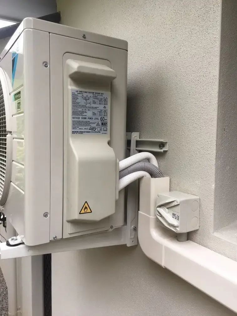 White Air Conditioning Unit Mounted on a Wall — Hinterland Air Conditioning Sunshine Coast in Palmwoods, QLD