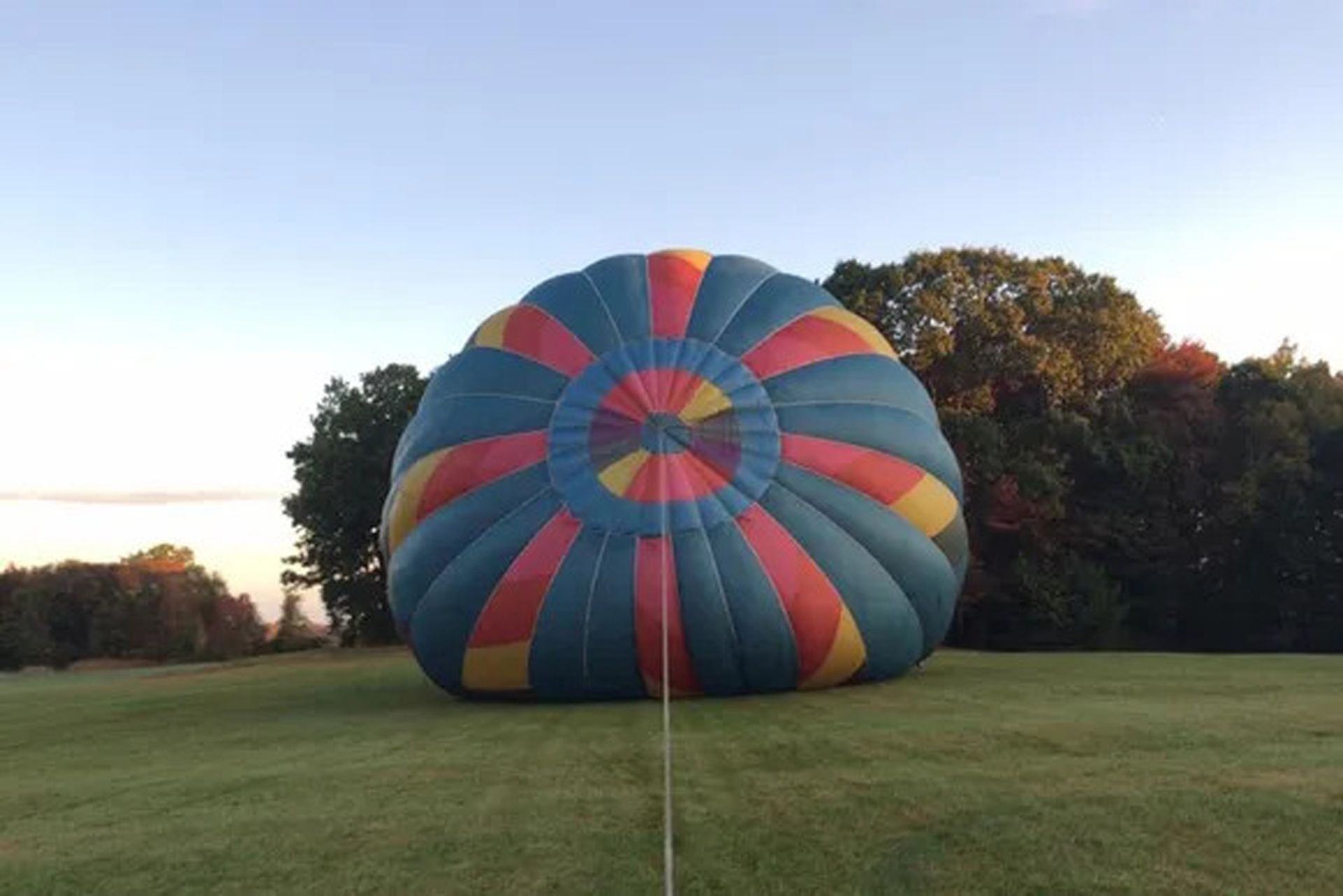 Hot Air Balloon Sitting on Grassy Field