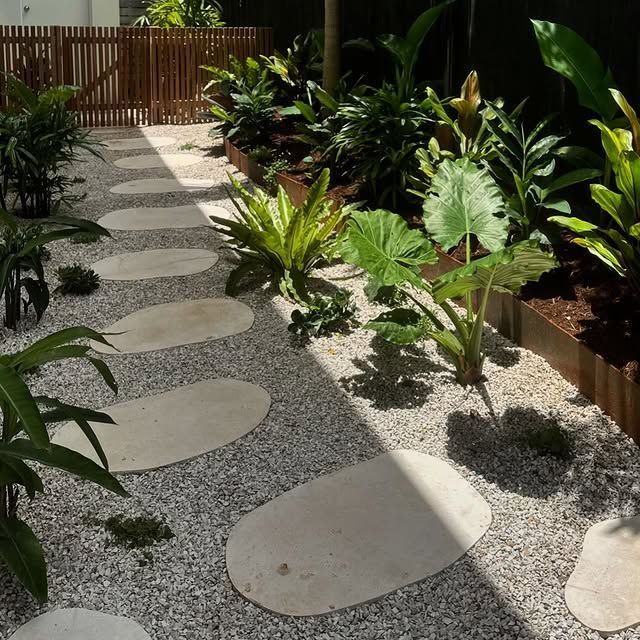 A Garden With Lots of Plants and Stepping Stones — Bloomscapes in Lennox Head NSW