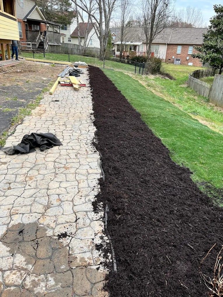 There is a lot of mulch on the side of the road.