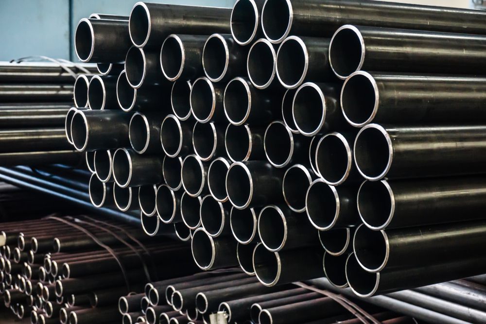 Aluminum and Chrome Stainless Pipes in Stack Waiting for Shipment in Warehouse — We Sell Steel Pipes in the Southern Highlands, NSW