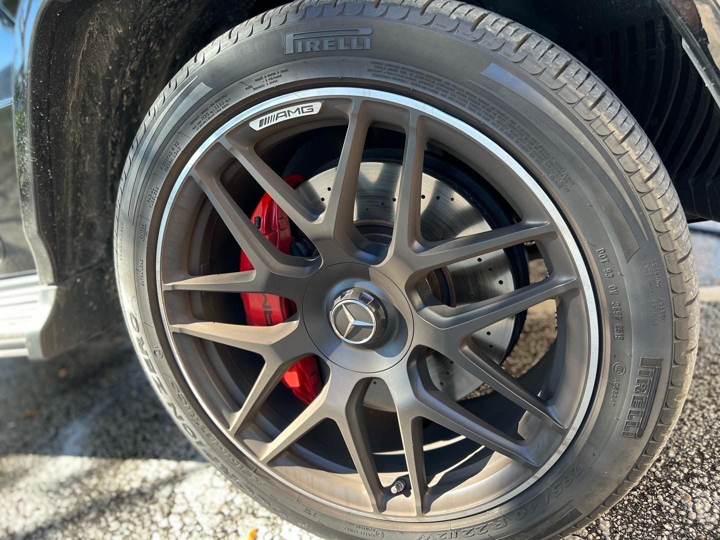 A close up of a car wheel with a tire on it.