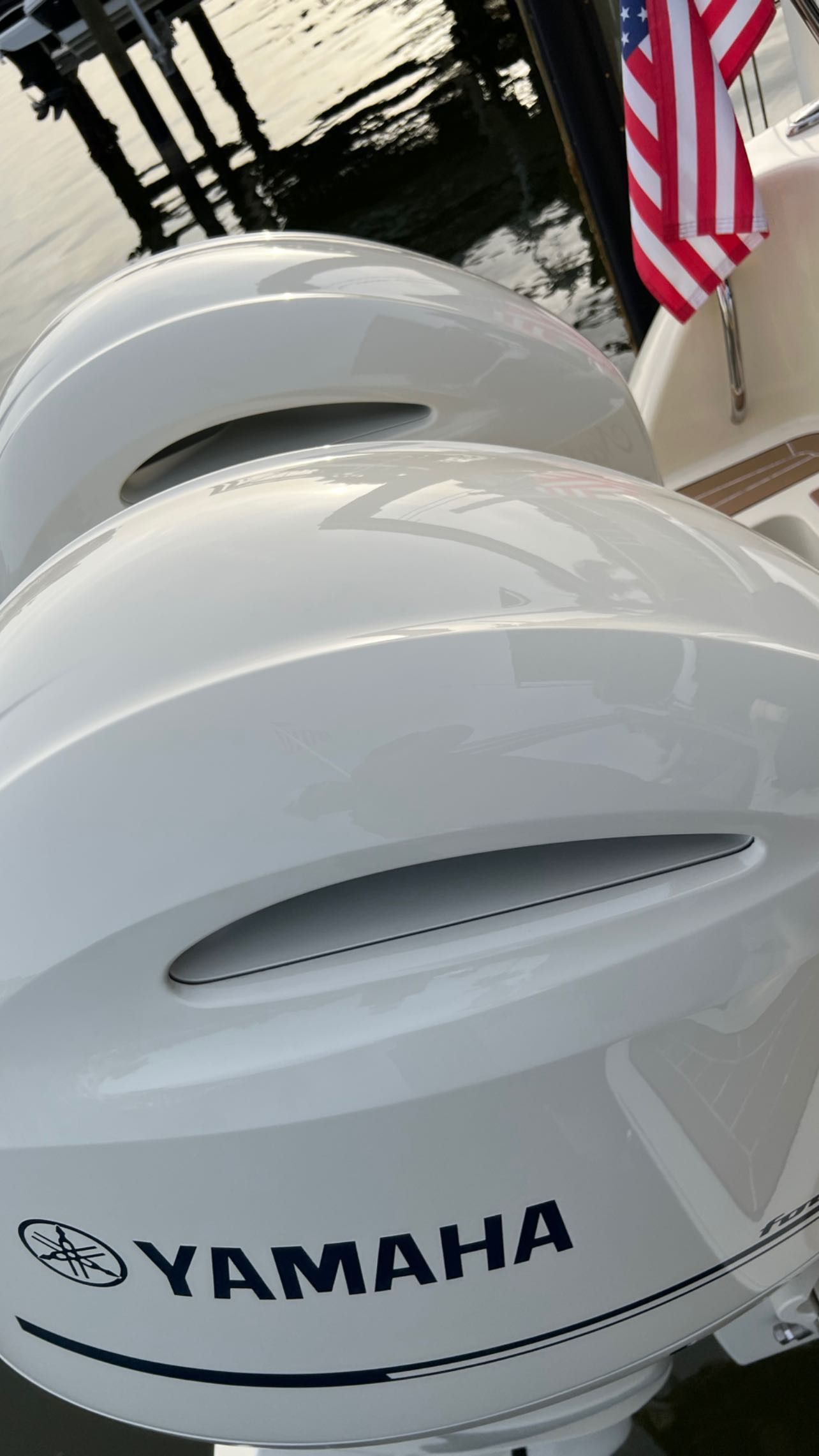 A close up of a yamaha outboard motor on a boat