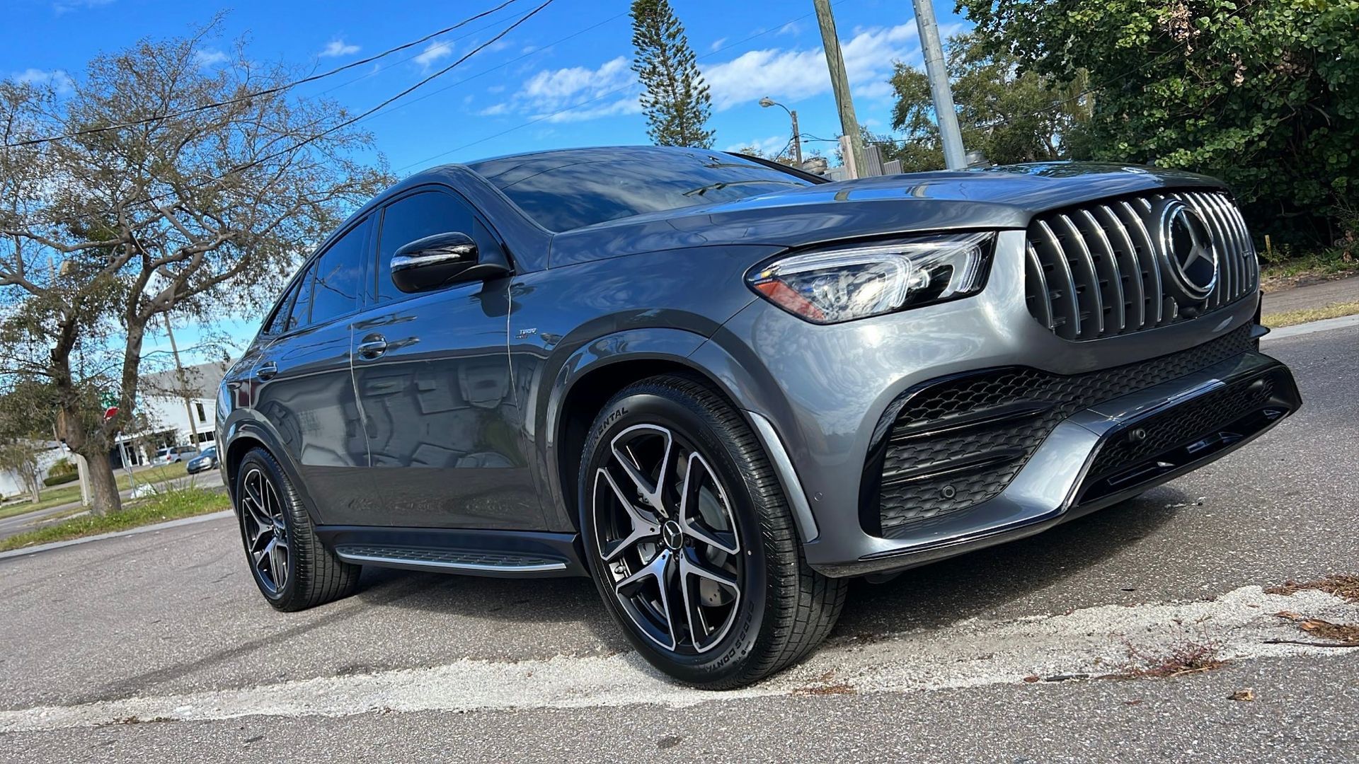 A mercedes benz gle coupe is parked on the side of the road.