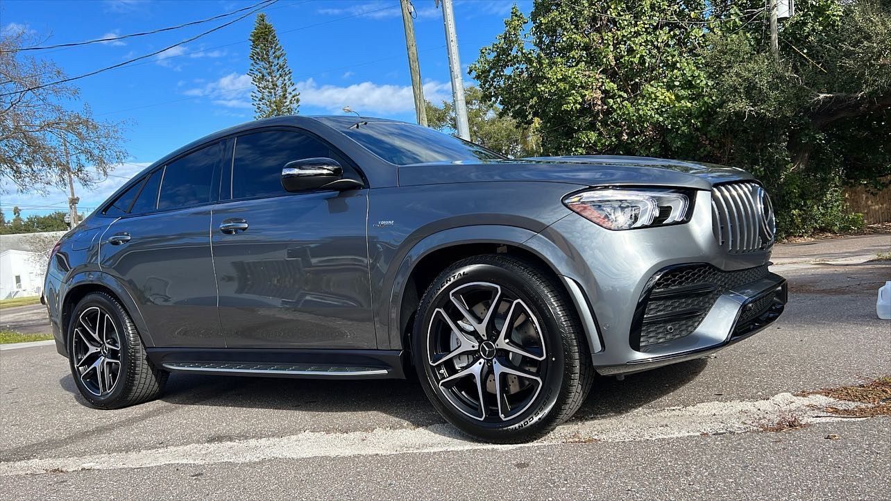 A mercedes benz gle 63 amg is parked on the side of the road.