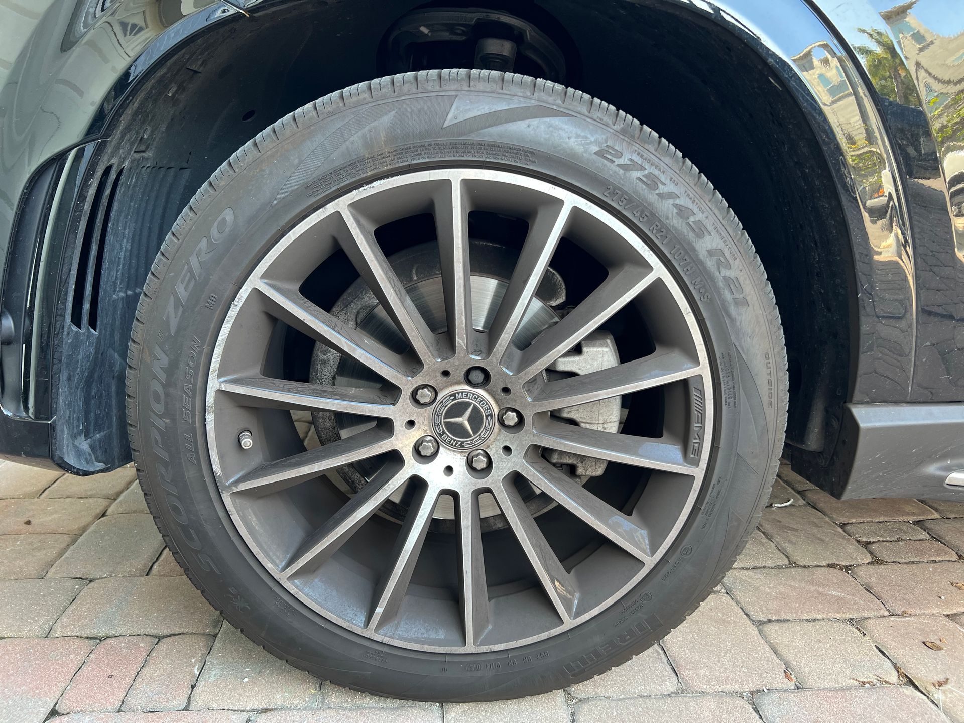 A close up of a car wheel with a tire on it.
