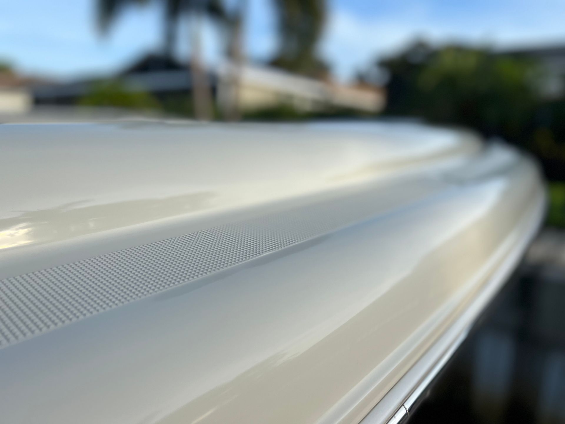 A close up of the bottom of a white boat.