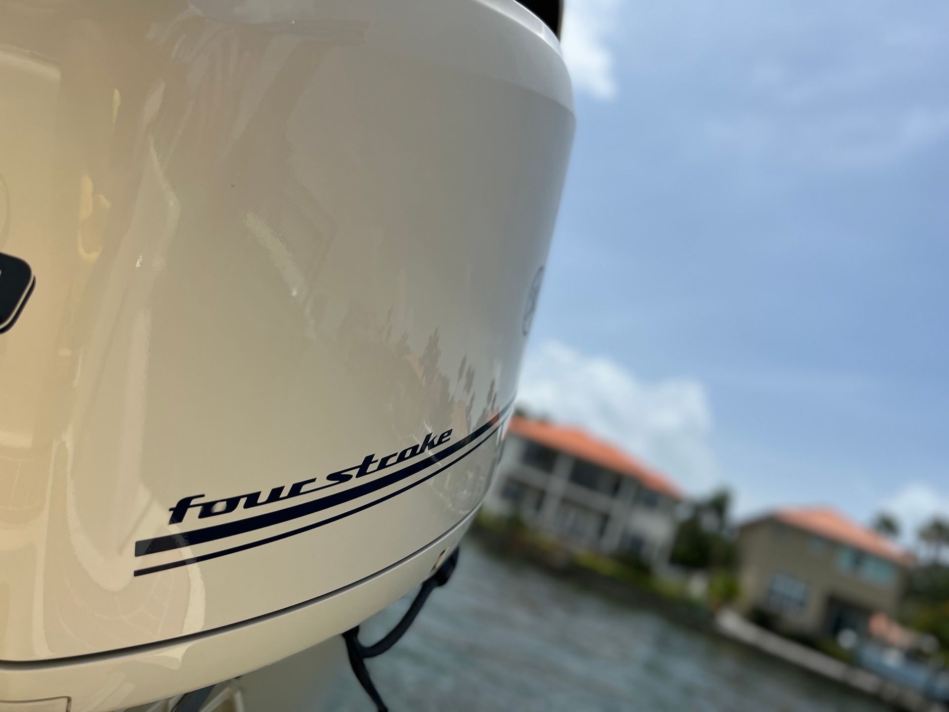 A close up of a four stroke engine on a boat
