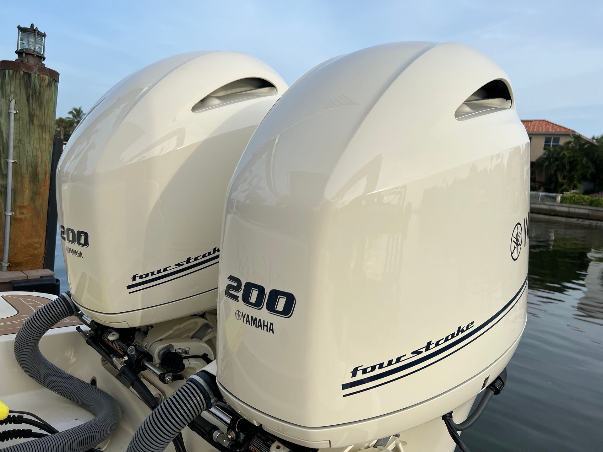 Two outboard motors on a boat with the number 200 on them