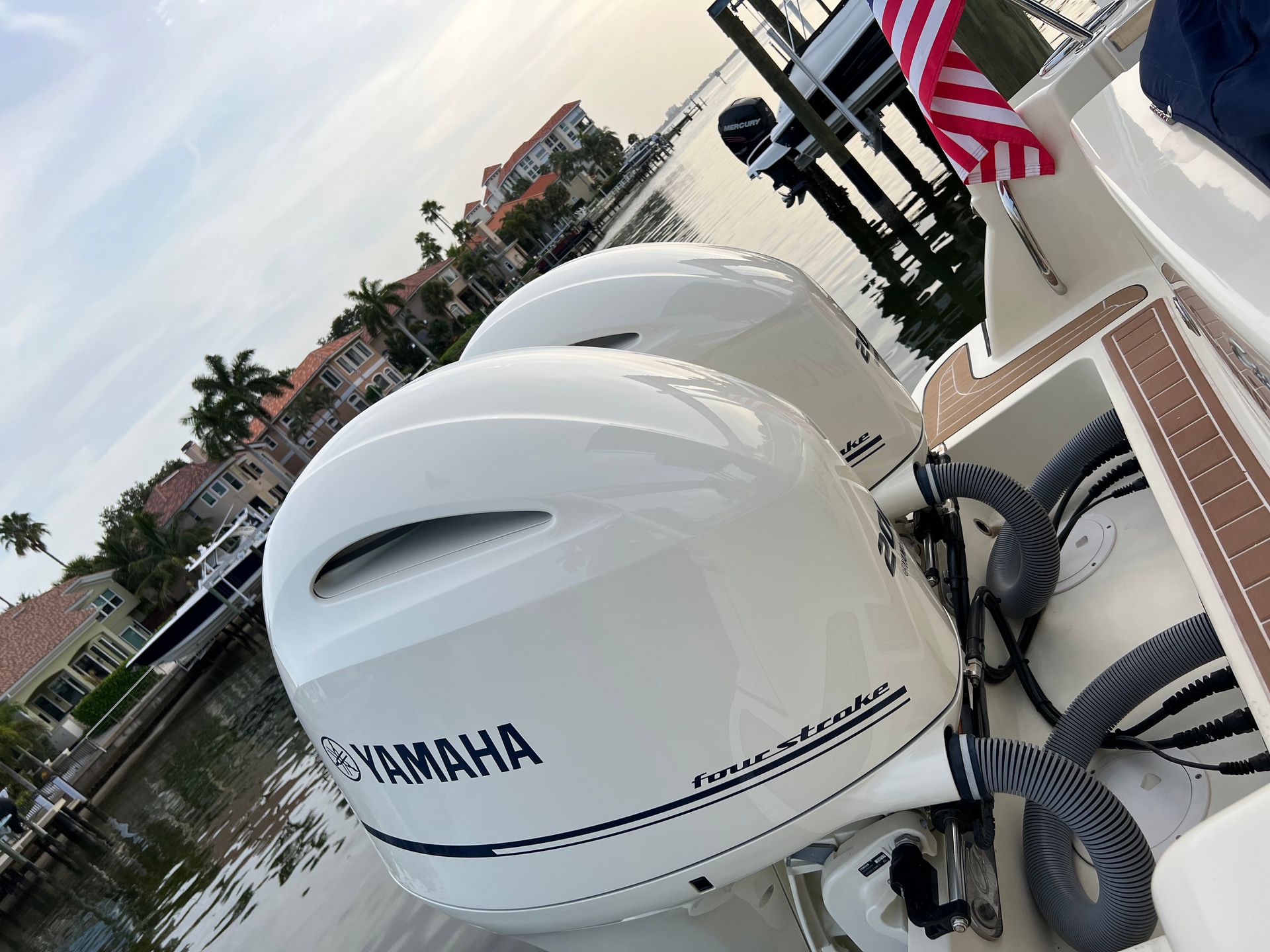 A yamaha outboard motor is sitting on the side of a boat.