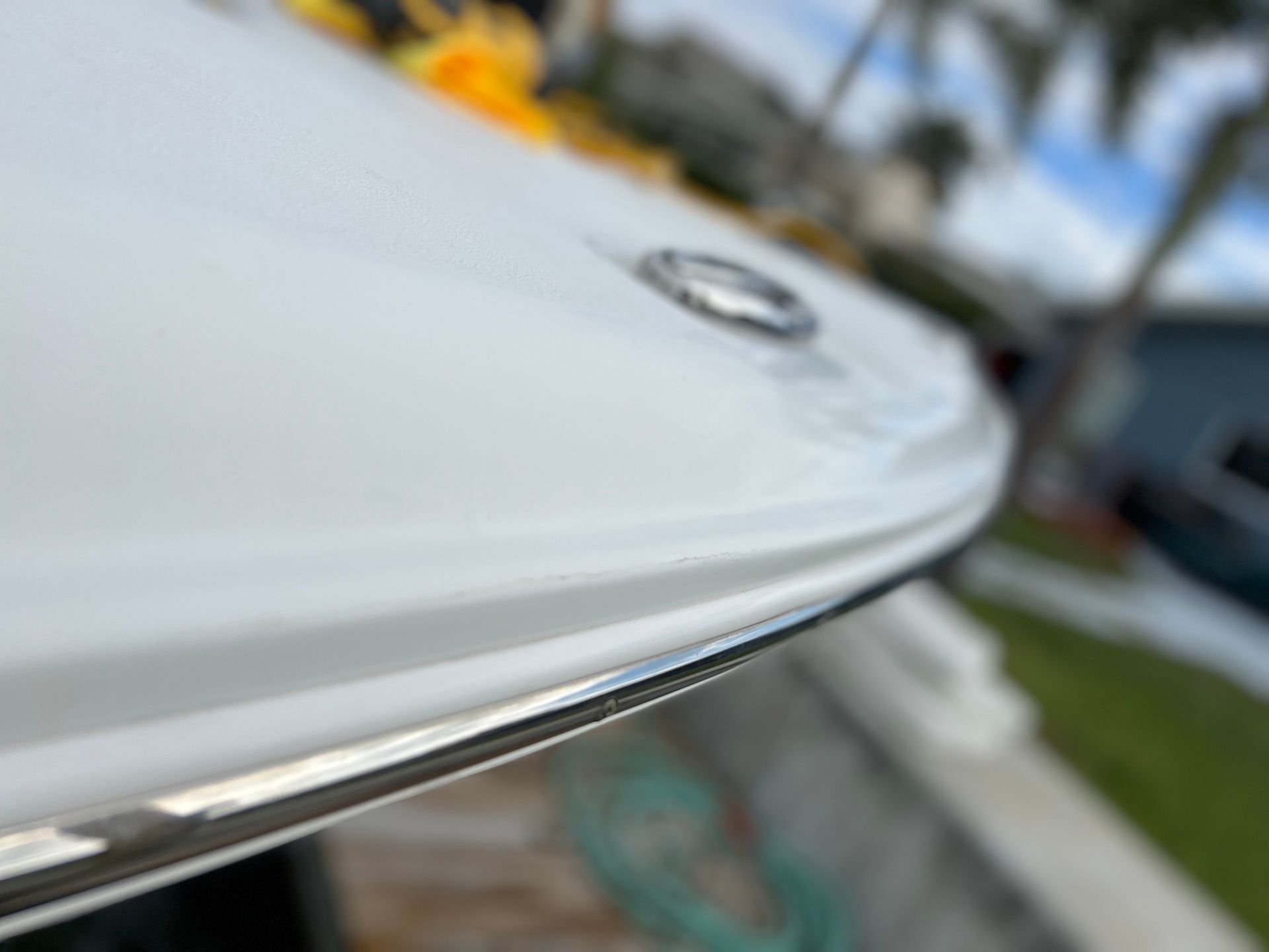 A close up of the bottom of a white boat.