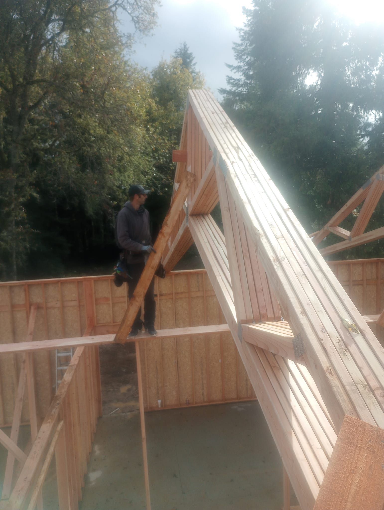 Man Assembling Wooden Frame — Roseburg, OR — K & R Construction and Framing, Inc.