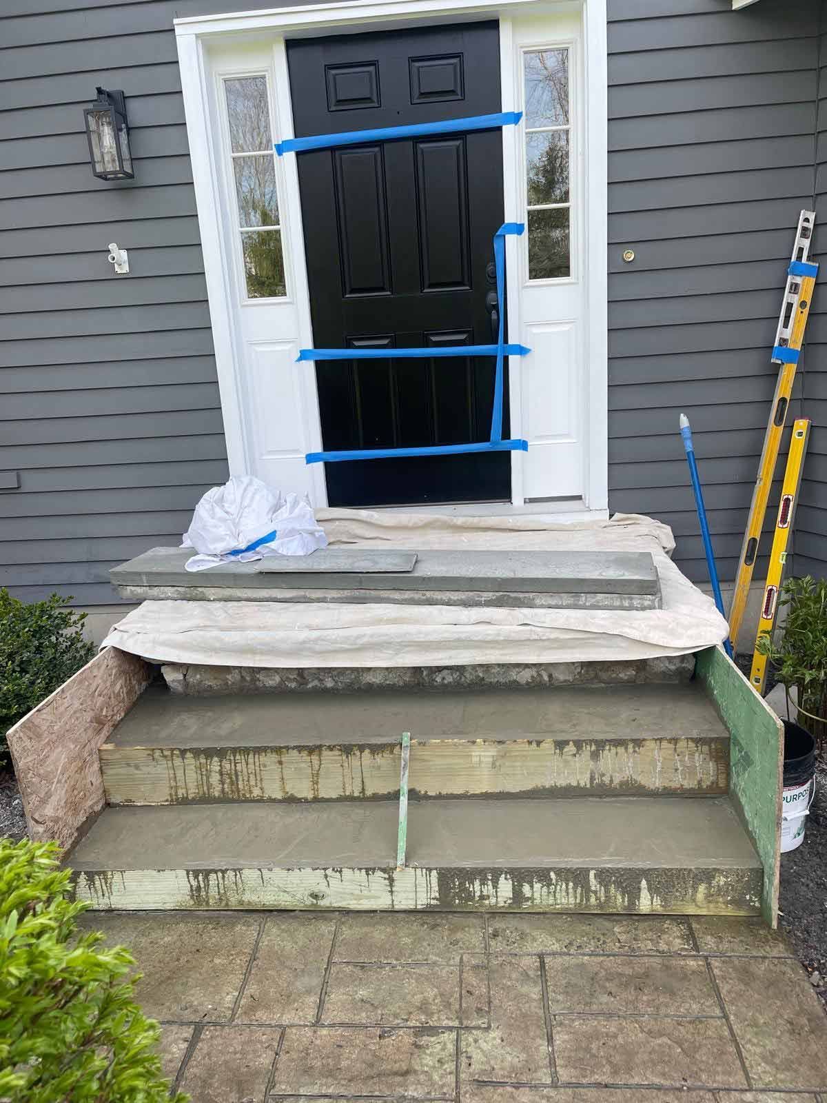 The Front Door Of A House Is Being Painted And The Steps Are Being Built. — Kingston, NY — T.I. Contracting
