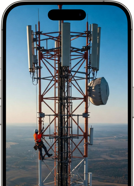 A phone screen shows a man climbing a telephone tower