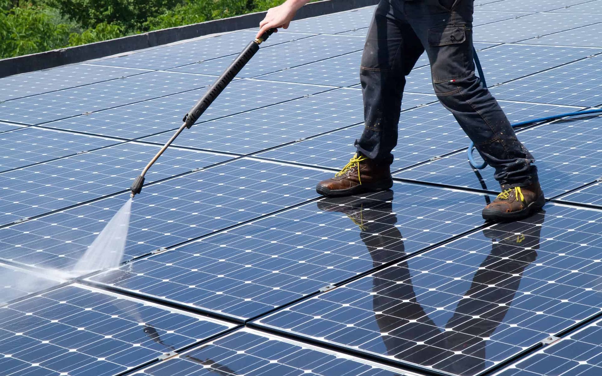 Solar panels installed on the rooftop of a charming brick house, harnessing renewable energy from the sun to power the home.